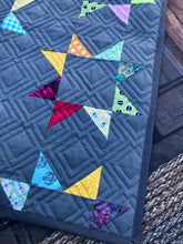 Load image into Gallery viewer, Rainbow stars quilt dark grey background
