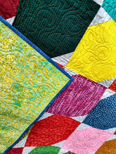 Load image into Gallery viewer, Bright and modern batik quilt
