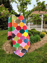 Load image into Gallery viewer, Bright and modern batik quilt
